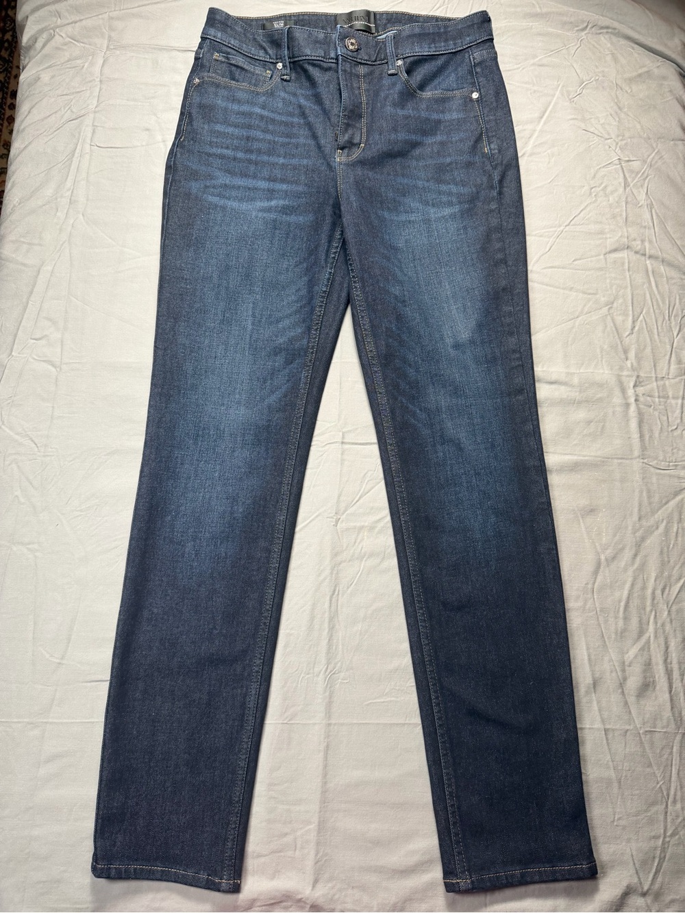 White House Black Market jeans in size 6 with a high rise and slim fit